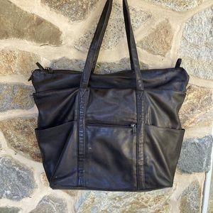 Vintage Tumi soft sided black leather carry-on, overnight bag